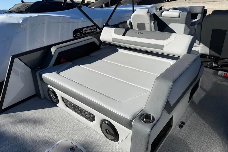 Slide: The Image of Alera M 23L 2026 boat interior with gray seating and modern design. - 8