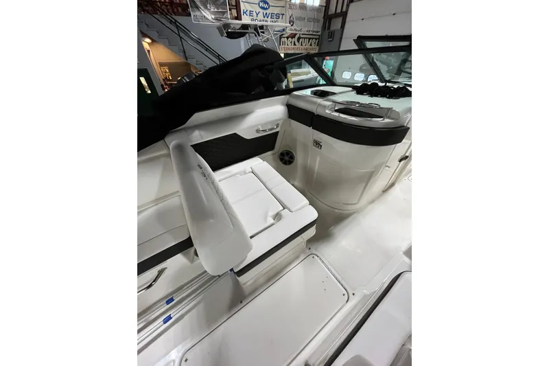 Slide: The Image of 2021 Sea Ray SDX 270 Outboard interior with seating and helm, showcasing modern design. - 15
