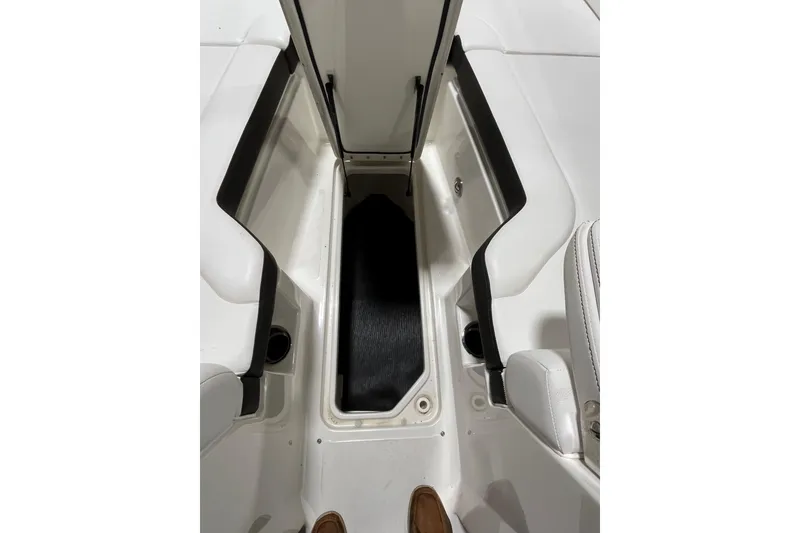 Slide: The Image of 2021 Sea Ray SDX 270 Outboard interior storage compartment, open and spacious. - 22
