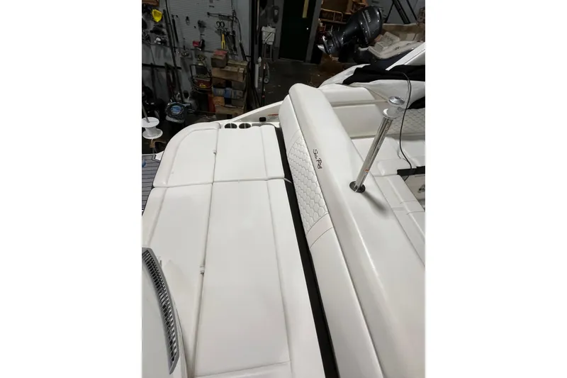 Slide: The Image of 2021 Sea Ray SDX 270 Outboard boat interior with white seating and sleek design. - 28