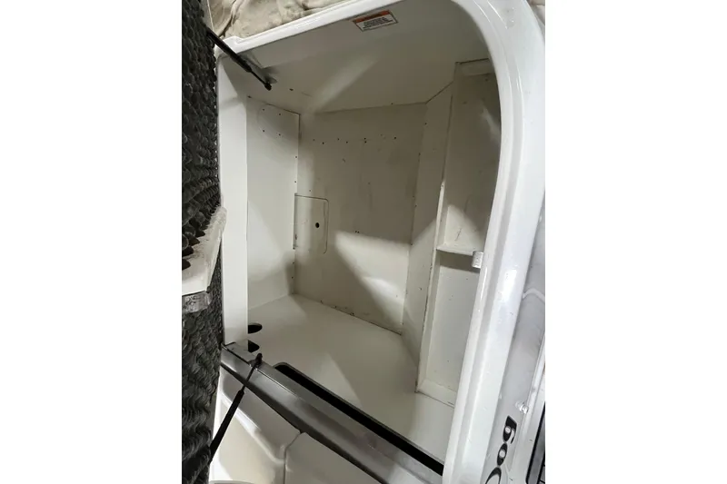 Slide: The Image of 2021 Sea Ray SDX 270 Outboard storage compartment, spacious and clean interior. - 29