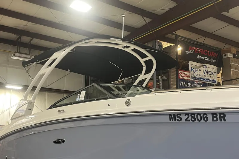 Slide: The Image of 2021 Sea Ray SDX 270 Outboard boat in indoor showroom with canopy. - 38