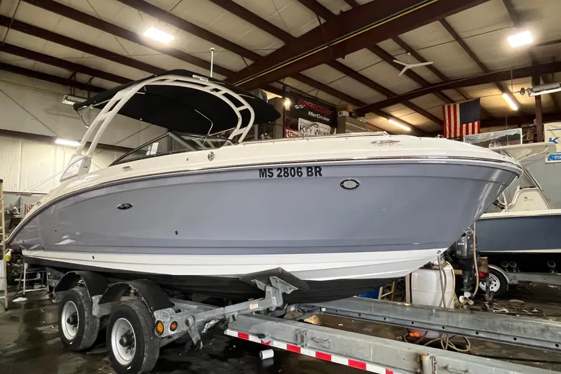 Slide: The Image of 2021 Sea Ray SDX 270 Outboard boat on trailer in indoor storage facility. - 39