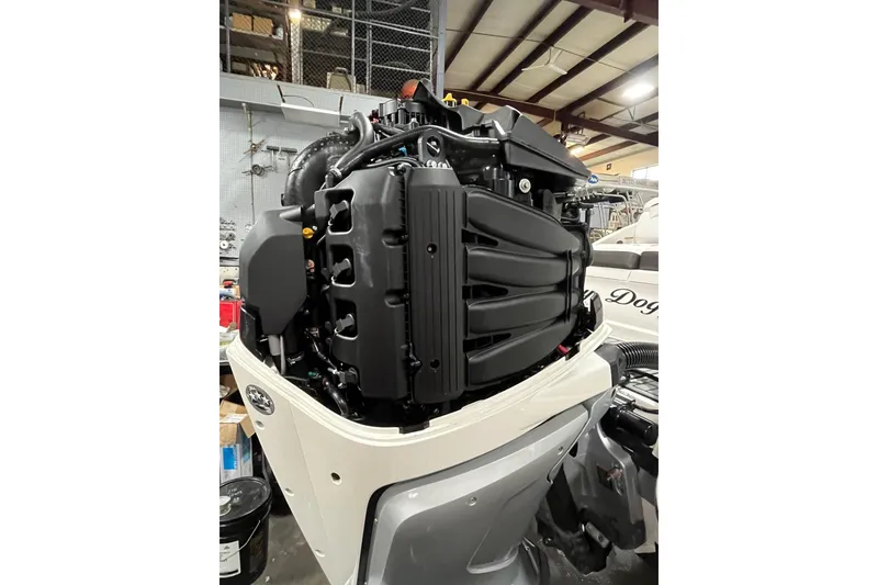 Slide: The Image of 2021 Sea Ray SDX 270 Outboard engine in a workshop setting. - 40