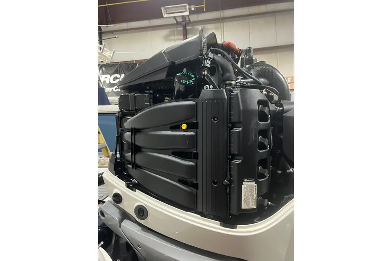 Slide: The Image of 2021 Sea Ray SDX 270 Outboard engine in a workshop setting. - 41