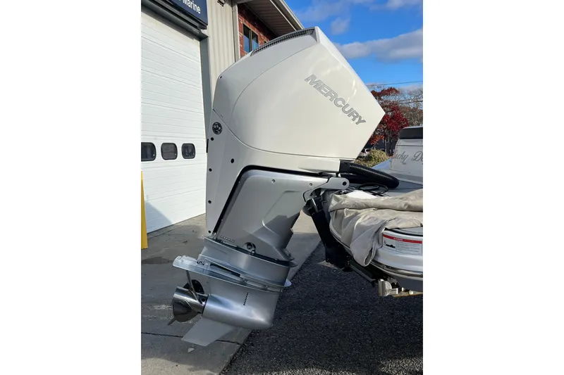 Slide: The Image of 2021 Sea Ray SDX 270 Outboard with Mercury engine, parked outside a garage. - 8