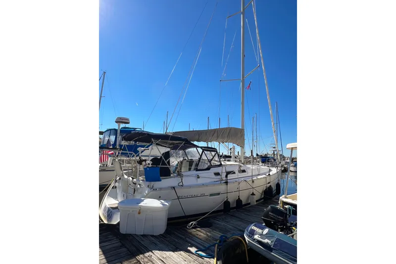 Slide: The Image of 2007 Beneteau 373 sailboat docked at marina under clear blue sky. - 12