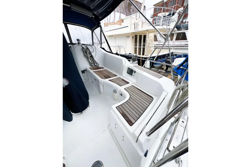 Slide: The Image of 2007 Beneteau 373 sailboat cockpit with teak seating and nautical equipment. - 14