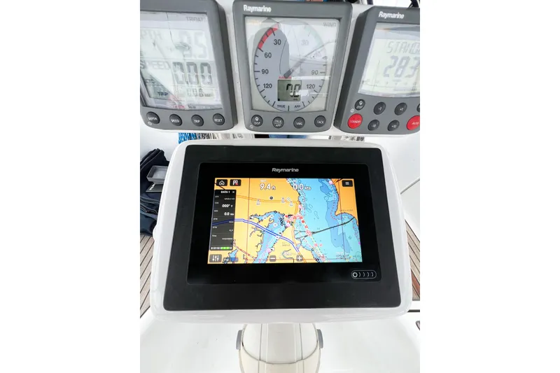 Slide: The Image of Navigation instruments on a 2007 Beneteau 373 sailboat, featuring Raymarine displays. - 28