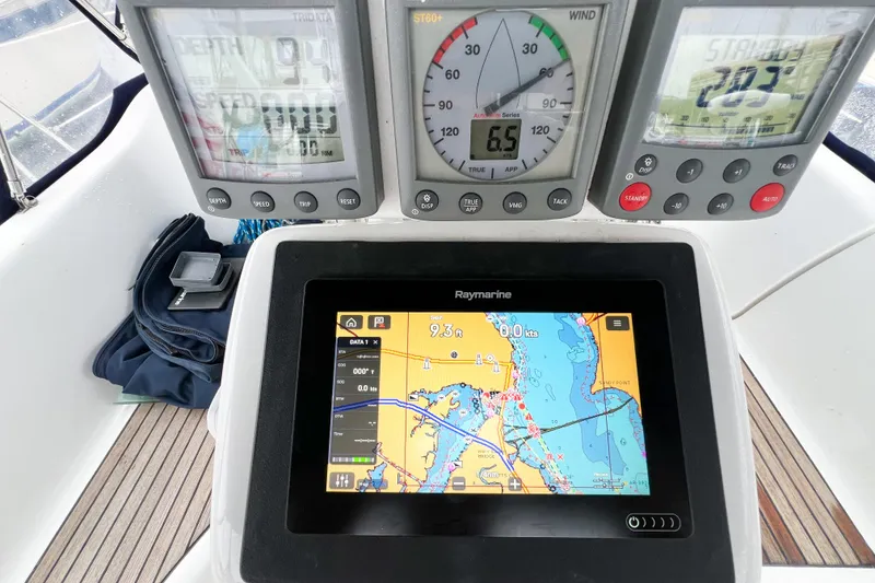 Slide: The Image of Navigation instruments on a 2007 Beneteau 373 sailboat, featuring Raymarine display and gauges. - 29