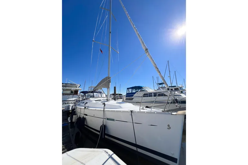 Slide: The Image of 2007 Beneteau 373 sailboat docked under clear blue sky. - 3