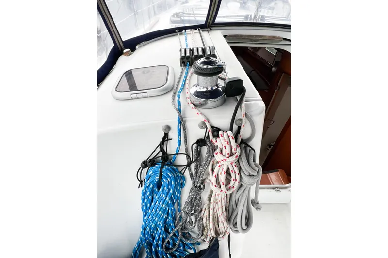 Slide: The Image of Sailing ropes and winch on 2007 Beneteau 373 yacht deck. - 31