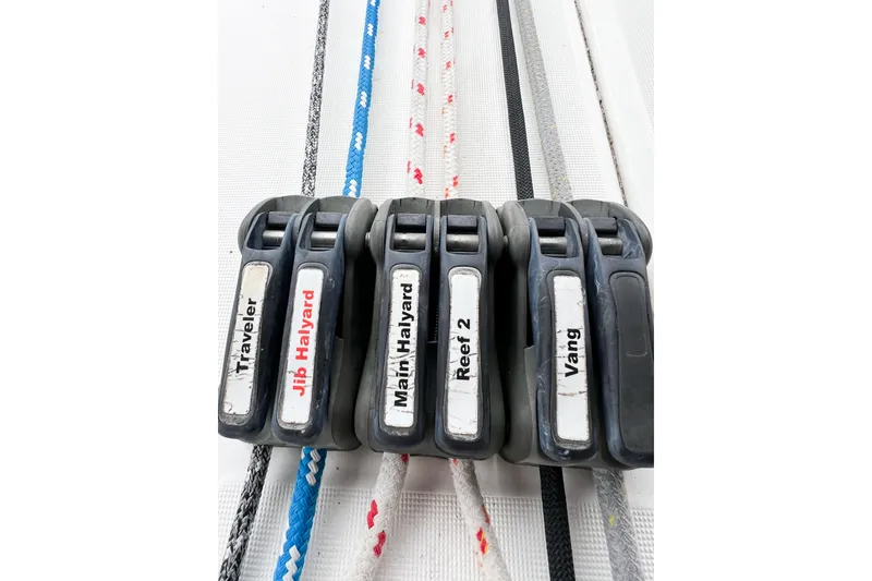 Slide: The Image of Close-up of labeled rope clutches on a 2007 Beneteau 373 sailboat. - 32
