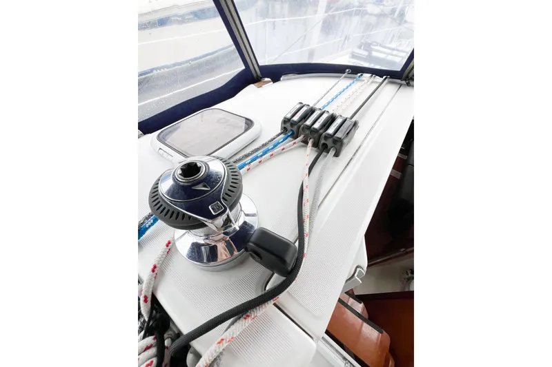 Slide: The Image of Winch and rope clutches on a 2007 Beneteau 373 sailboat deck. - 33