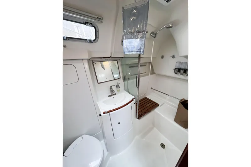 Slide: The Image of Bathroom of 2007 Beneteau 373 yacht with shower, sink, and toilet. - 44