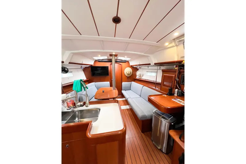 Slide: The Image of Luxurious interior of 2007 Beneteau 373 sailboat with wood finish and modern amenities. - 45
