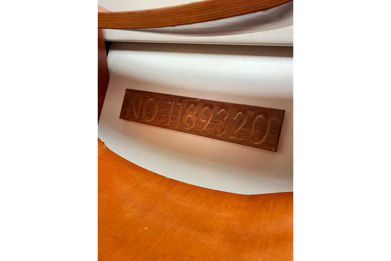 Slide: The Image of Wooden plaque with engraved number "NO 1189320" on a Beneteau 373, 2007 model. - 52