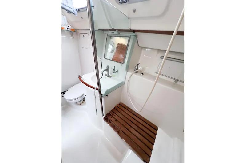 Slide: The Image of 2007 Beneteau 373 yacht bathroom with shower, sink, and wooden seat. - 60