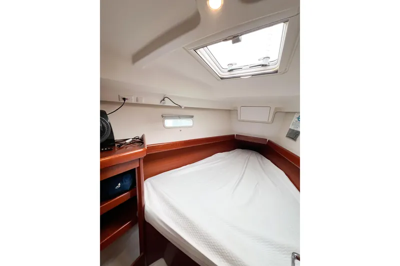 Slide: The Image of Cozy cabin interior of 2007 Beneteau 373 sailboat with bed and skylight. - 62