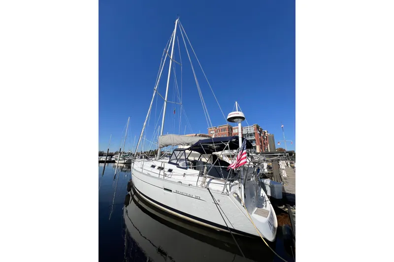 Slide: The Image of 2007 Beneteau 373 sailboat docked at marina under clear blue sky. - 7