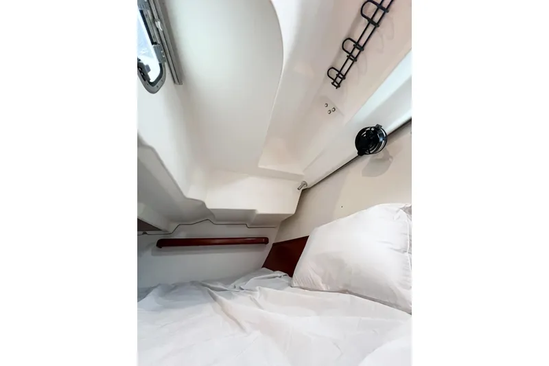 Slide: The Image of Interior cabin of 2007 Beneteau 373 sailboat with bed and porthole. - 70