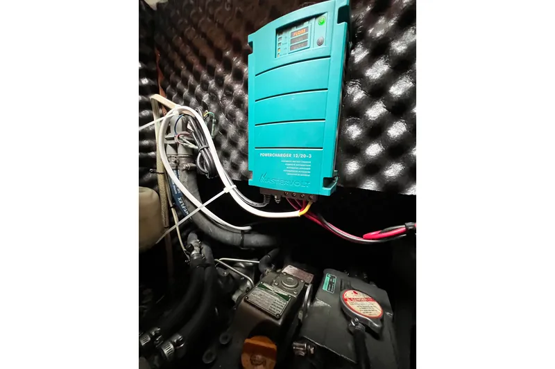 Slide: The Image of Engine compartment of a 2007 Beneteau 373 with a Mastervolt PowerCharger installed. - 78