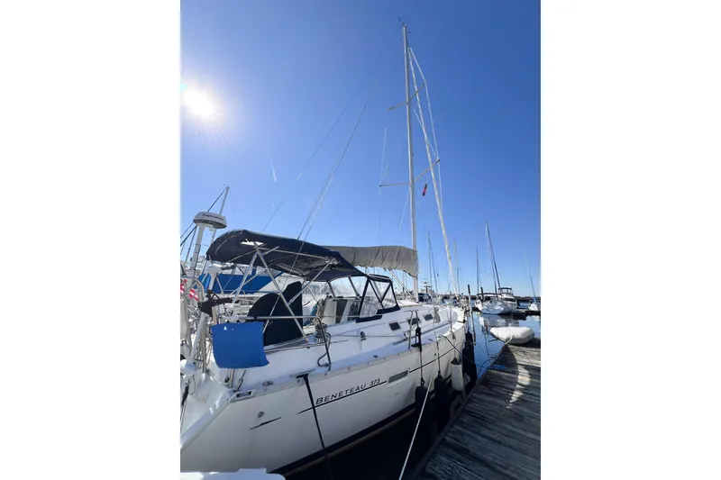 Slide: The Image of 2007 Beneteau 373 sailboat docked under clear blue sky. - 9