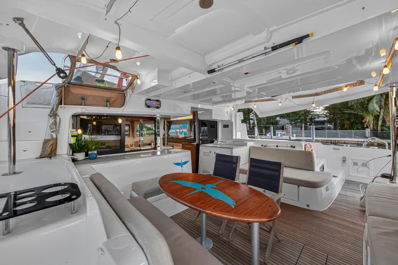 Slide: The Image of Luxurious 2021 Lagoon 46 Owner's Version yacht interior with elegant seating and modern design. - 100