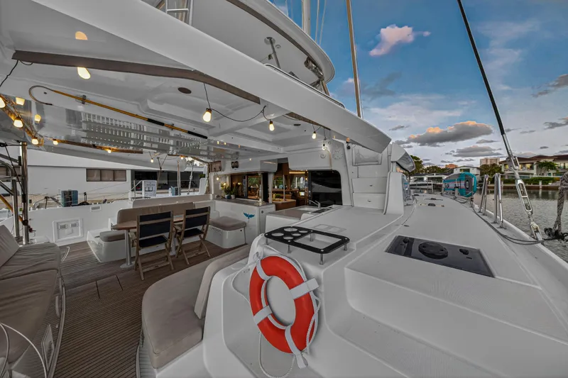 Slide: The Image of 2021 Lagoon 46 Owner's Version yacht with spacious deck and modern amenities. - 101