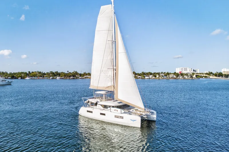Slide: The Image of 2021 Lagoon 46 Owner's Version catamaran sailing on a sunny day. - 106