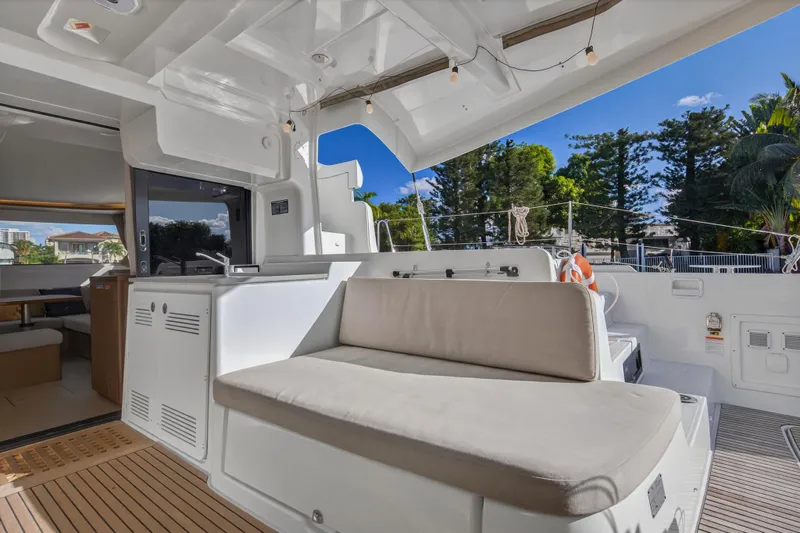 Slide: The Image of Luxurious Lagoon 46 Owner's Version 2021 yacht with spacious outdoor seating area. - 17