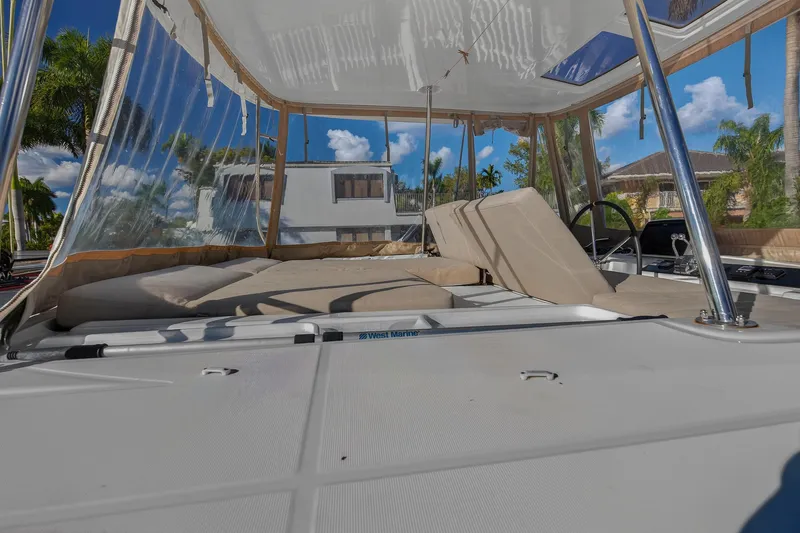 Slide: The Image of Lagoon 46 Owner's Version 2021 catamaran with spacious deck and clear canopy. - 31