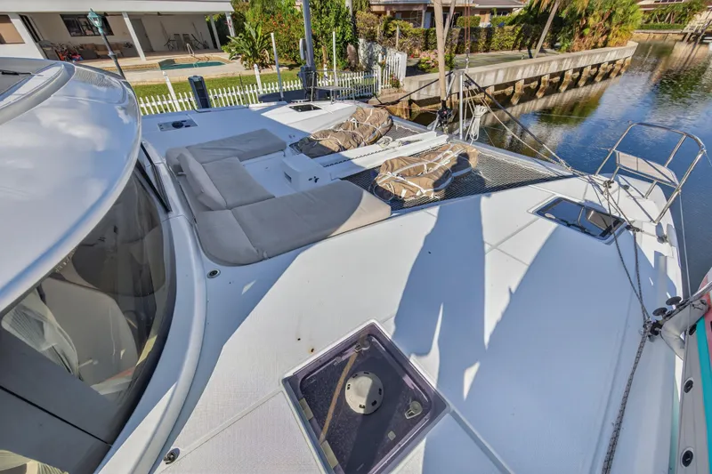 Slide: The Image of 2021 Lagoon 46 Owner's Version catamaran with spacious deck and comfortable seating. - 39