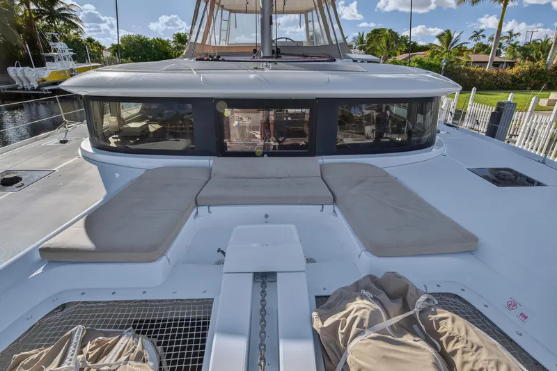 Slide: The Image of 2021 Lagoon 46 Owner's Version catamaran with spacious deck seating and modern design. - 43