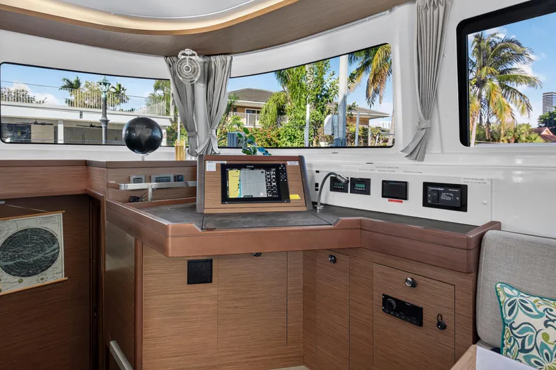 Slide: The Image of Interior of 2021 Lagoon 46 Owner's Version yacht with navigation equipment. - 58