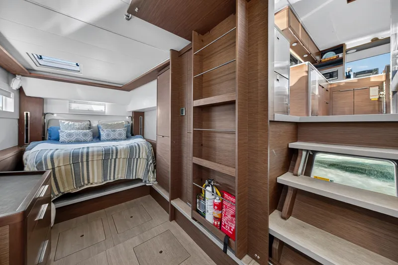 Slide: The Image of Luxurious interior of 2021 Lagoon 46 Owner's Version catamaran with cozy bedroom and modern design. - 73