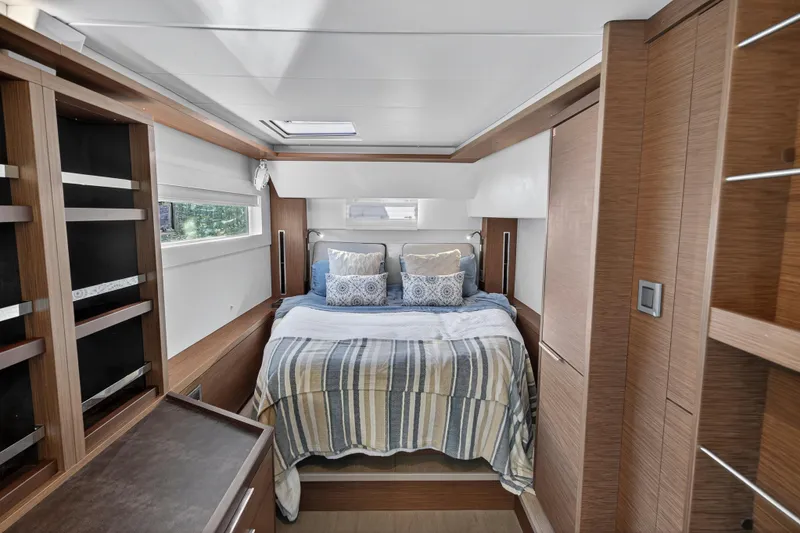 Slide: The Image of Luxurious bedroom interior of 2021 Lagoon 46 Owner's Version yacht with modern wood finishes. - 74