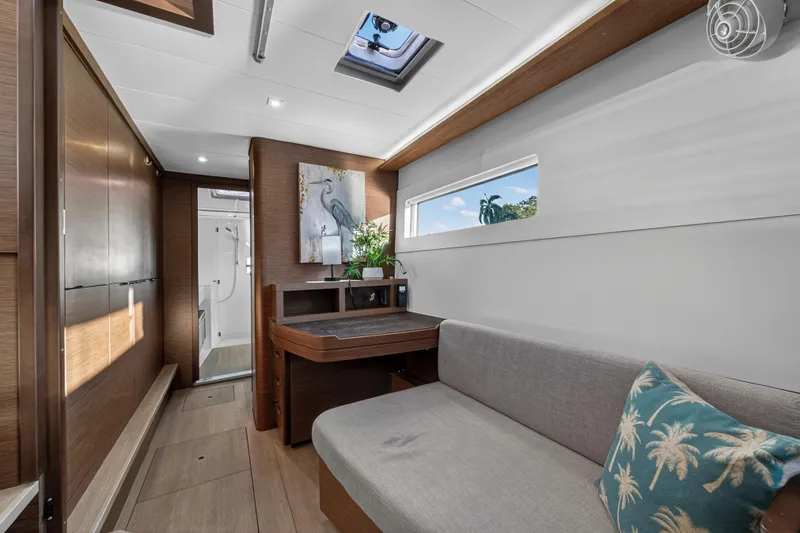 Slide: The Image of Luxurious interior of 2021 Lagoon 46 Owner's Version yacht with modern furnishings. - 77