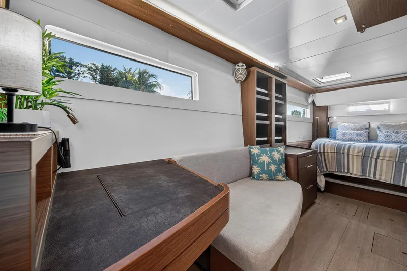 Slide: The Image of Luxurious interior of 2021 Lagoon 46 Owner's Version yacht with modern furnishings. - 78