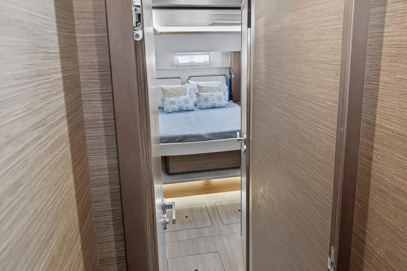 Slide: The Image of Interior view of 2021 Lagoon 46 Owner's Version yacht bedroom with modern decor. - 83