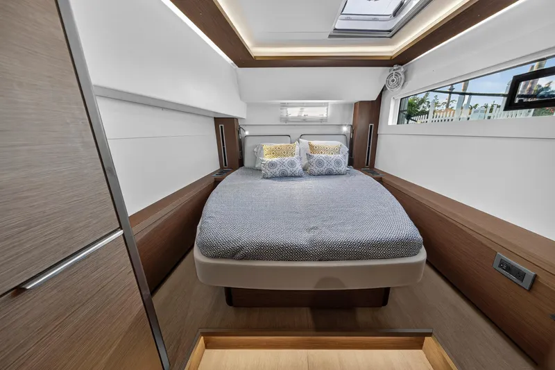 Slide: The Image of Luxurious bedroom interior of 2021 Lagoon 46 Owner's Version yacht, featuring modern design and cozy bedding. - 93