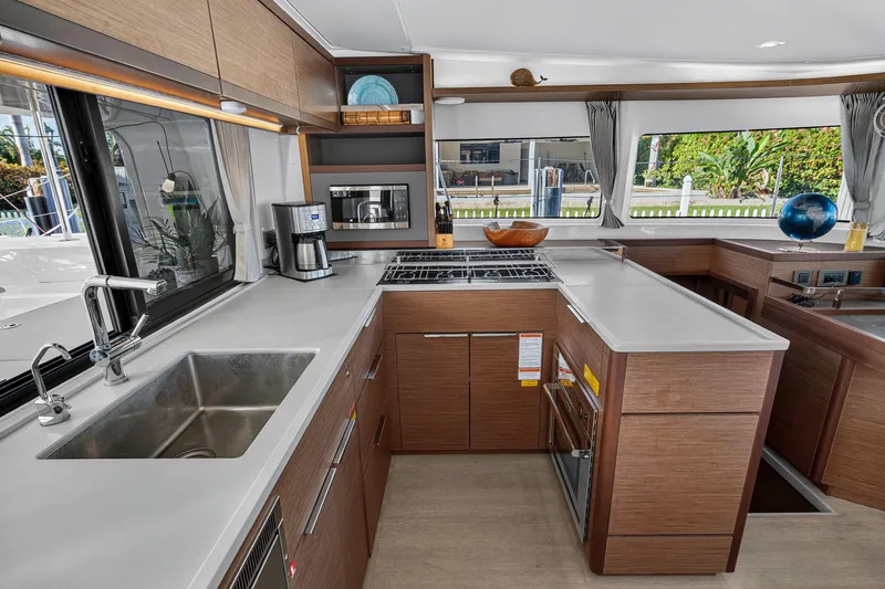 Slide: The Image of Modern kitchen interior of 2021 Lagoon 46 Owner's Version yacht with sleek countertops and appliances. - 66