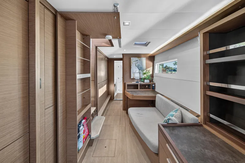Slide: The Image of Luxurious interior of 2021 Lagoon 46 Owner's Version yacht with modern wood finishes. - 76
