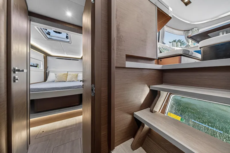 Slide: The Image of Luxurious interior of 2021 Lagoon 46 Owner's Version yacht, featuring a cozy bedroom and modern design. - 85