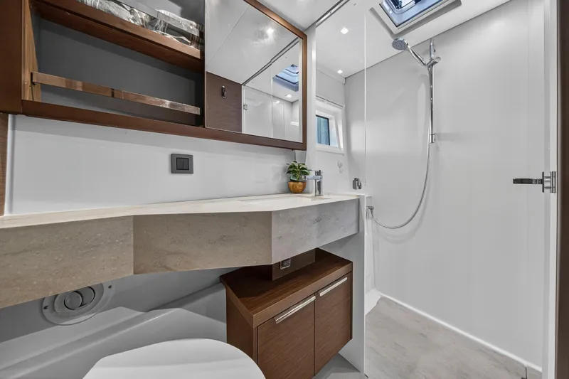 Slide: The Image of Luxurious bathroom in 2021 Lagoon 46 Owner's Version yacht, featuring modern fixtures and elegant design. - 97