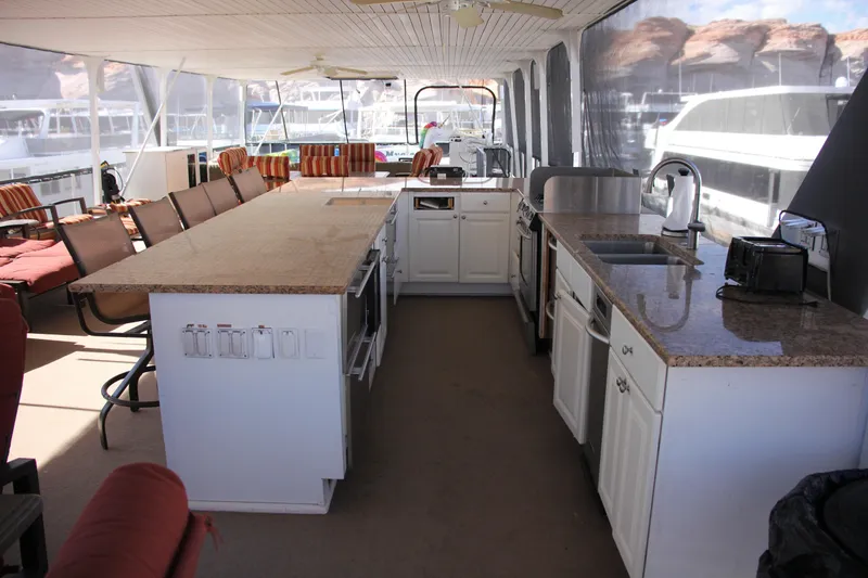 Slide: The Image of Luxurious 2007 Sumerset Steel Away houseboat kitchen with granite countertops and modern amenities. - 10
