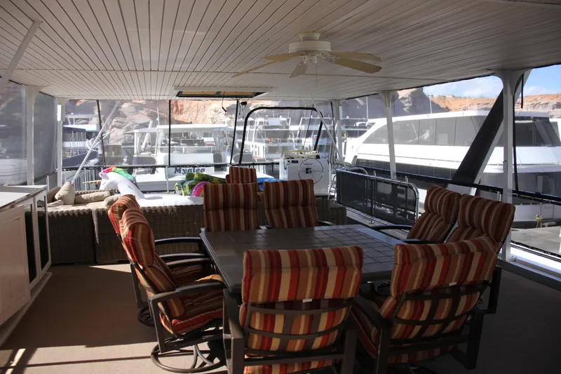 Slide: The Image of Spacious 2007 Sumerset Steel Away houseboat deck with seating and scenic marina view. - 13