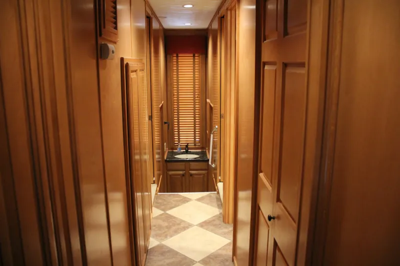Slide: The Image of Narrow hallway with wooden paneling and a small sink, Sumerset Steel Away 2007. - 2