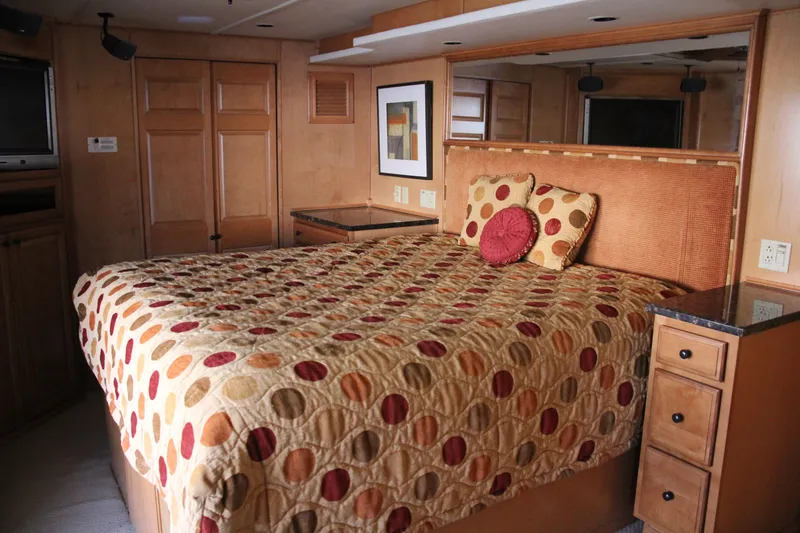 Slide: The Image of Cozy bedroom in 2007 Sumerset Steel Away houseboat with polka dot bedding. - 3
