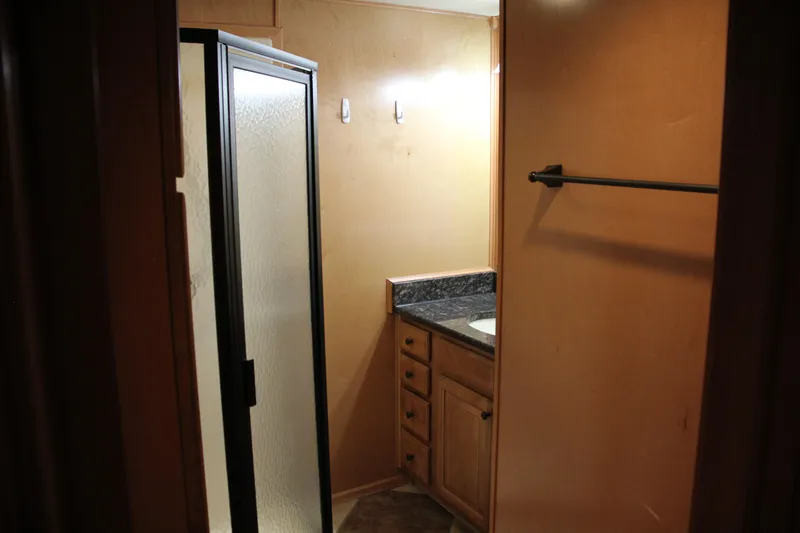 Slide: The Image of Bathroom interior of 2007 Sumerset Steel Away houseboat with shower and vanity. - 4